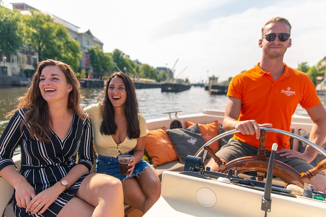 Amsterdam Luxury Canal Cruise + Unlimited Drinks & Bites option - Amstel highlights: Magere Brug, Munttoren, and the UNESCO canal ring feel