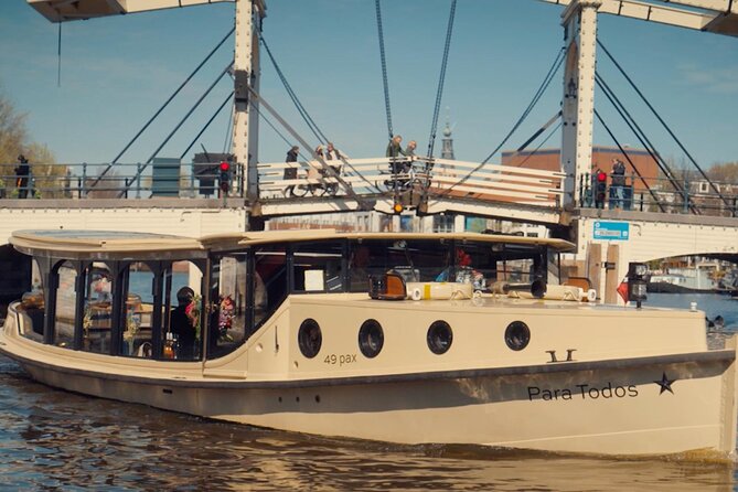Amsterdam: Luxury Canal Cruise with Historic VR Experience - Stepping onto a luxury enclosed canal cruise at Leidseplein