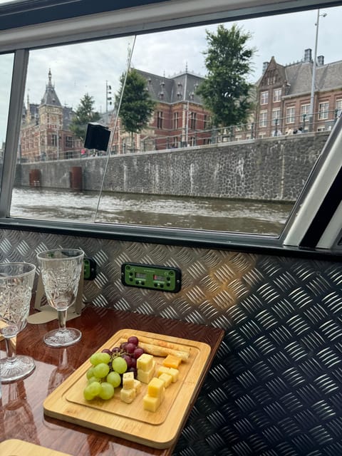 Amsterdam: Luxury Cheese & Wine Canal Cruise - Drinks, guide narration, and the vibe on board