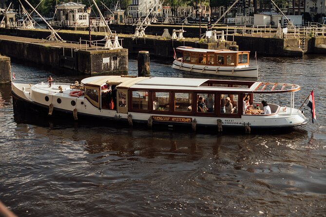 Amsterdam: Luxury Saloon Boat Cruise with Cocktails & Waffle - Why this 1-hour canal cruise feels like a treat at $18