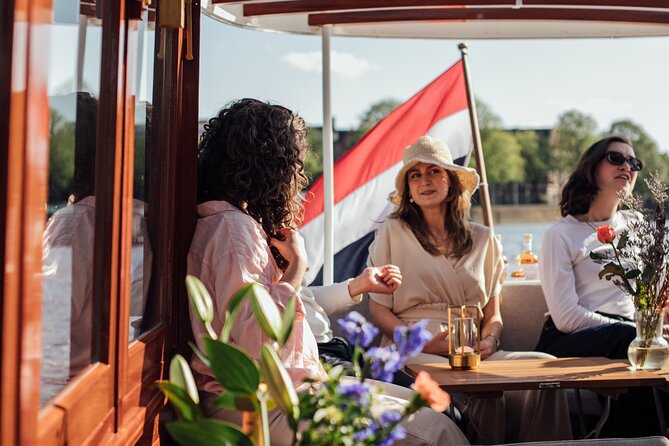 Amsterdam: Luxury Saloon Boat Cruise with Cocktails & Waffle - Boat comfort matters in Amsterdam, and they plan for weather