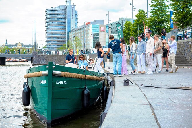 Amsterdam Newest Canal Cruise with local guide and small group - Amstel River moments: Blauwbrug, museums, and the waterside story