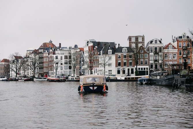 Amsterdam Newest Canal Cruise with local guide and small group - Old-city highlights: Dancing Houses and why they lean