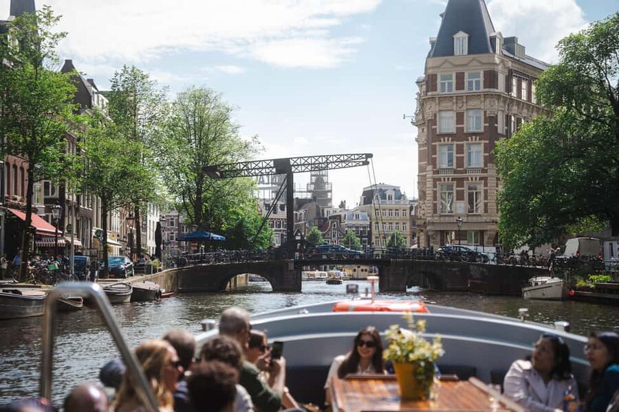 Amsterdam: Open Boat Canal Cruise (with Free Spritz Option) - Skipper stories and the live guide factor: what can make or break it