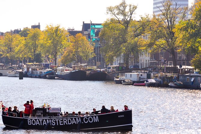 Amsterdam Open Boat Cruise in Old City Centre with Drinks Options - Entering the Open-Boat Ride in Amsterdam’s Old City Centre