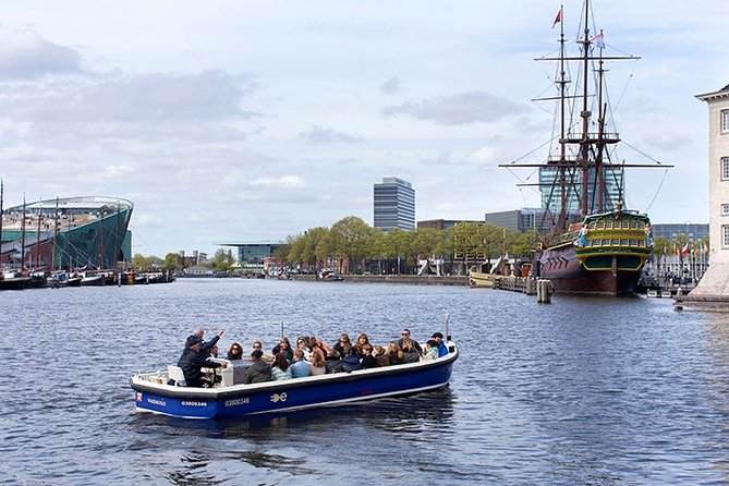 Amsterdam Open Boat Sightseeing Canal Cruise - Amstel Hotel, NEMO, and the museum shoreline feel