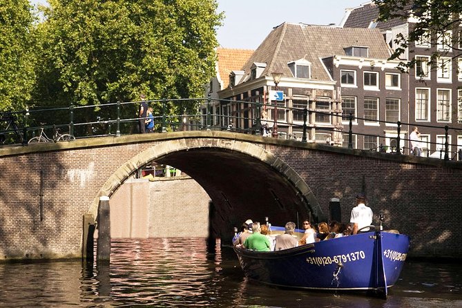 Amsterdam Open Boat Sightseeing Canal Cruise - Amsterdam Centraal and the city’s iron-and-stone statement