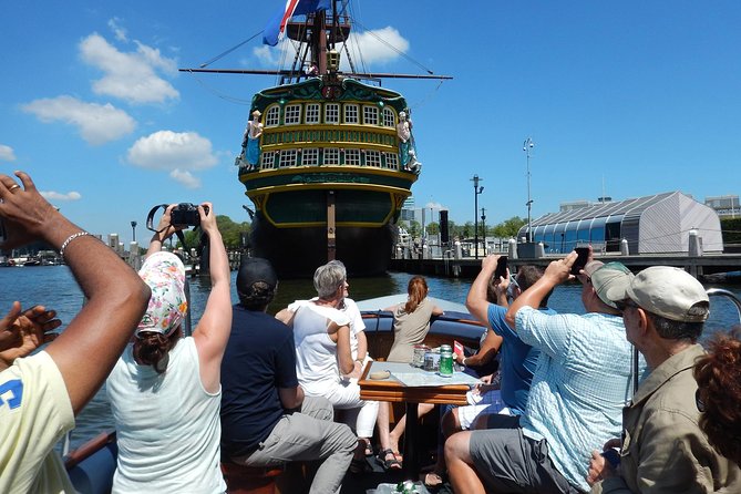 Amsterdam Open Boat Tour with Local Guide - Comfort and clothing: smart casual in an open boat