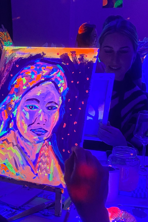 Amsterdam: Paint and Sip in the Dark at Rembrandt van Wine - The heart of it, painting in the dark with neon glow steps