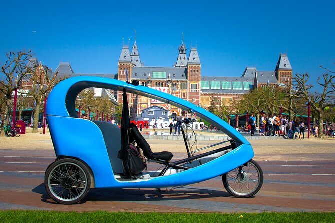 Amsterdam Pedicab City Tour (2 hours) - Getting comfortable on a blue pedicab, and what to expect on pickup