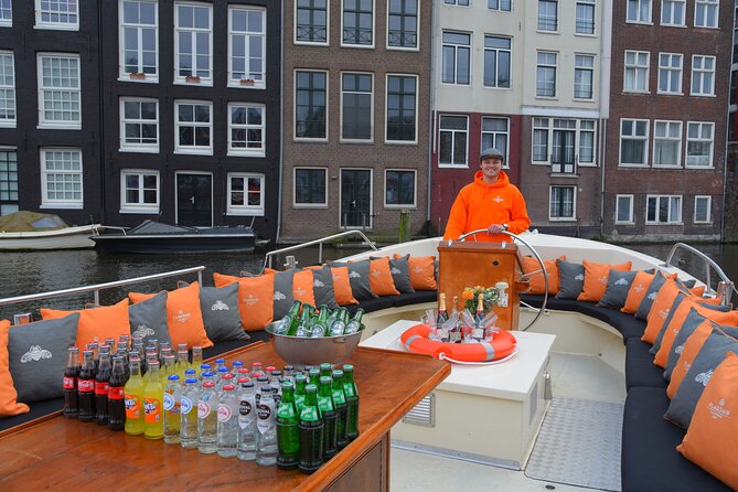 Amsterdam Private Boat Trip With Skipper, Burger and Beers - Art, war stories, and a big Protestant bell tower from the water