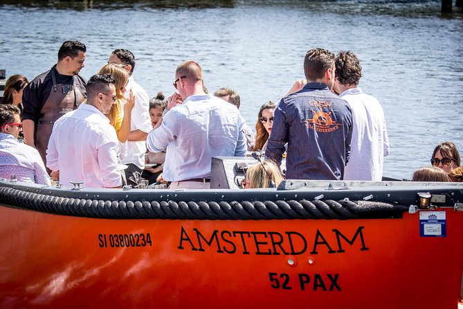 Amsterdam Private Boat Trip With Skipper, Burger and Beers - Oldest bridges, Gothic architecture in the Red Light District area, and classic canal life