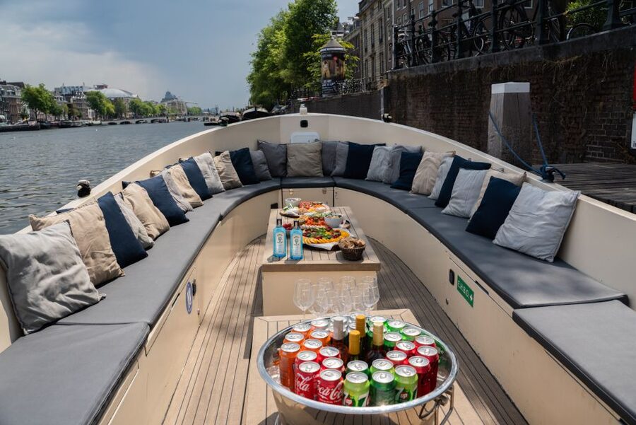 Amsterdam: Private Canal Booze Cruise with Unlimited Drinks - Private Canal Booze Cruise Basics: 1 Hour on a Covered Boat With Unlimited Drinks