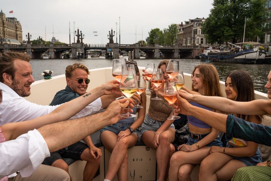 Amsterdam: Private Canal Booze Cruise with Unlimited Drinks - Passing the Red Light District: Seeing Central Amsterdam Without the Hassle