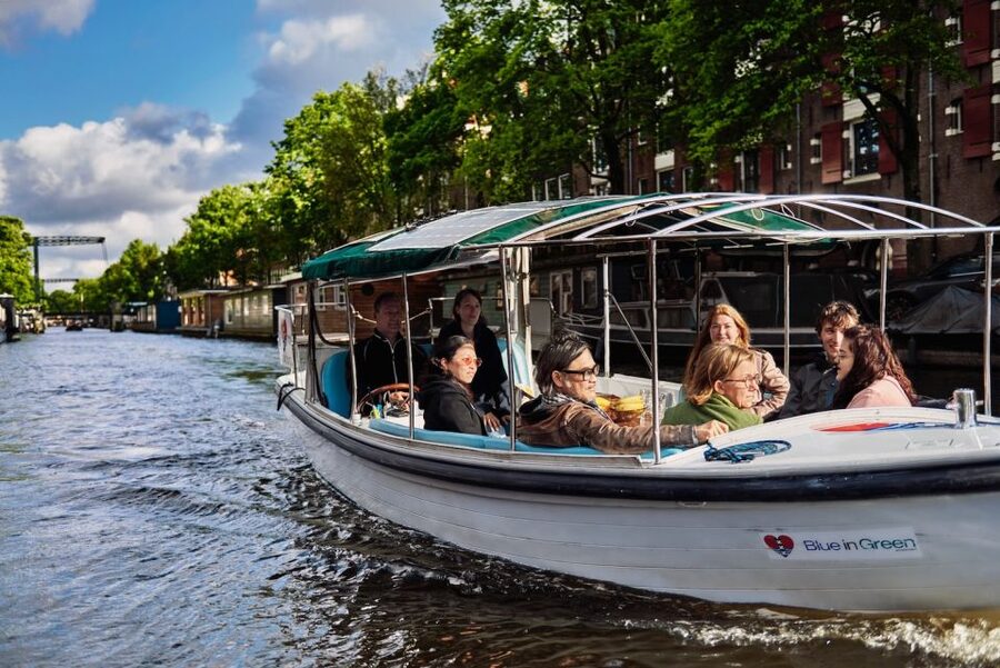 Amsterdam: Private Canal Tour - Meeting the light blue canvas roof boat, fast