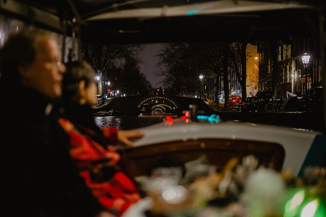 Amsterdam: Private Romantic Evening Canal Cruise + Bubbles/Snacks - Floating Flower Market and the bridge-and-building highlights you should watch for