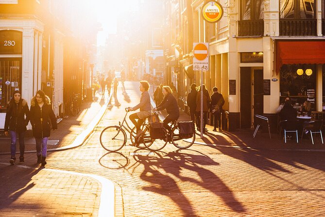 Amsterdam Private Tour: Highlights & Hidden Gems by Bike or Foot - Rembrandtplein: from butter and dairy roots to today’s hangout