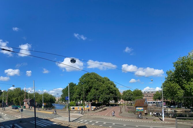 Amsterdam Private Walking Tour with Dinner Experience - Nieuwmarkt and Lastage: where canals meet past political headaches