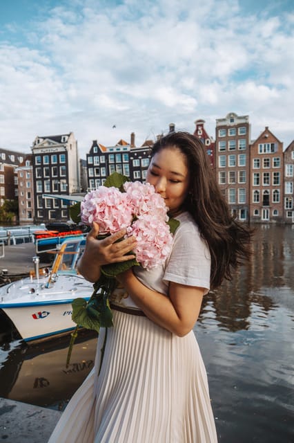 Amsterdam: Professional Photoshoot at the Canals - Damrak Avenue: swapping quiet canal shots for Amsterdam’s most famous scene