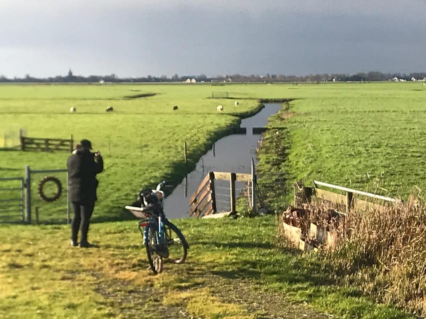 Amsterdam: Rainbow Rural Bike Tour With Local Gay Guide - Ferry ride back with northern Amsterdam skyline views