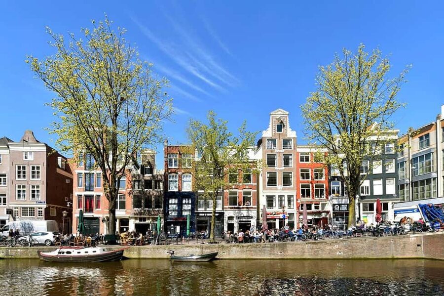 Amsterdam: Red Light District Tour in English or German - Oude Kerk and Old Town stops that keep the walk grounded