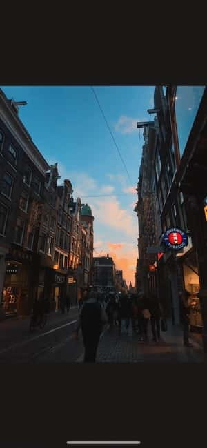 Amsterdam: Red Light District Tour in German/English for groups of 4 or more - The old church stop that helps you place the district in time