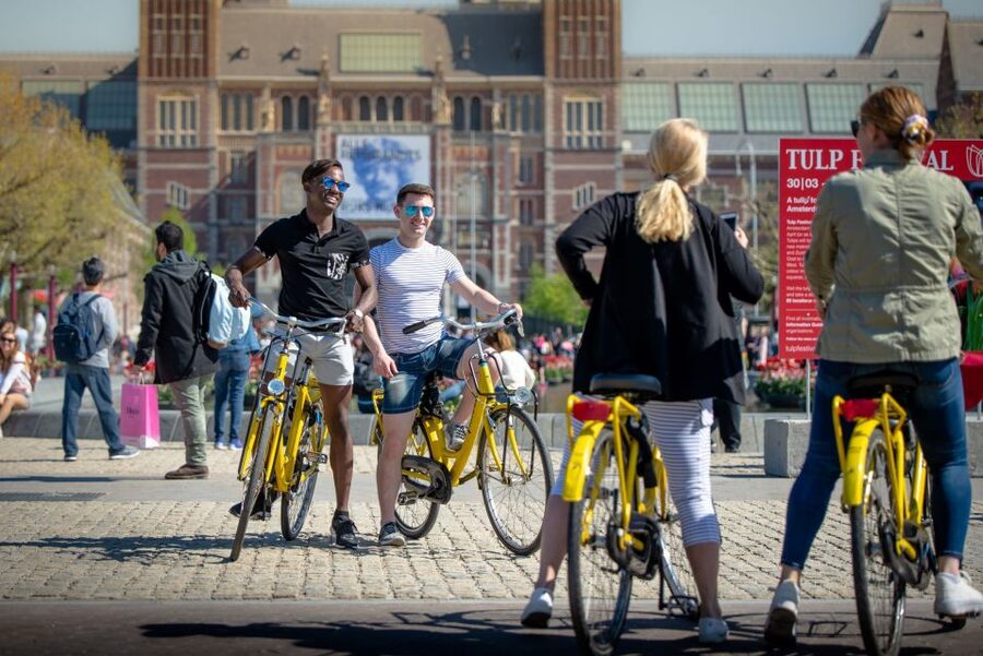 Amsterdam: Relaxed City Highlights Guided Bike Tour - Starting at Nieuwezijds Kolk and the Yellow Bike Base
