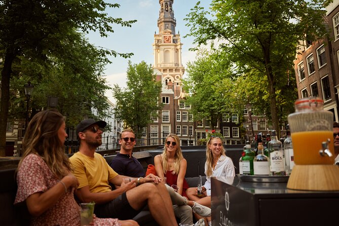 Amsterdam: Saloon Boat Cruise + Unlimited Drinks & Bite option - A One-Hour Amsterdam Canal Fix, with a Real Live Host