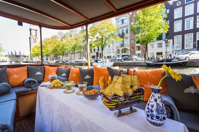 Amsterdam Small-Group Bike Tour With Canal Cruise, Drinks, Cheese - Prins Hendrik Bust and the canal cruise, cheese and drinks included