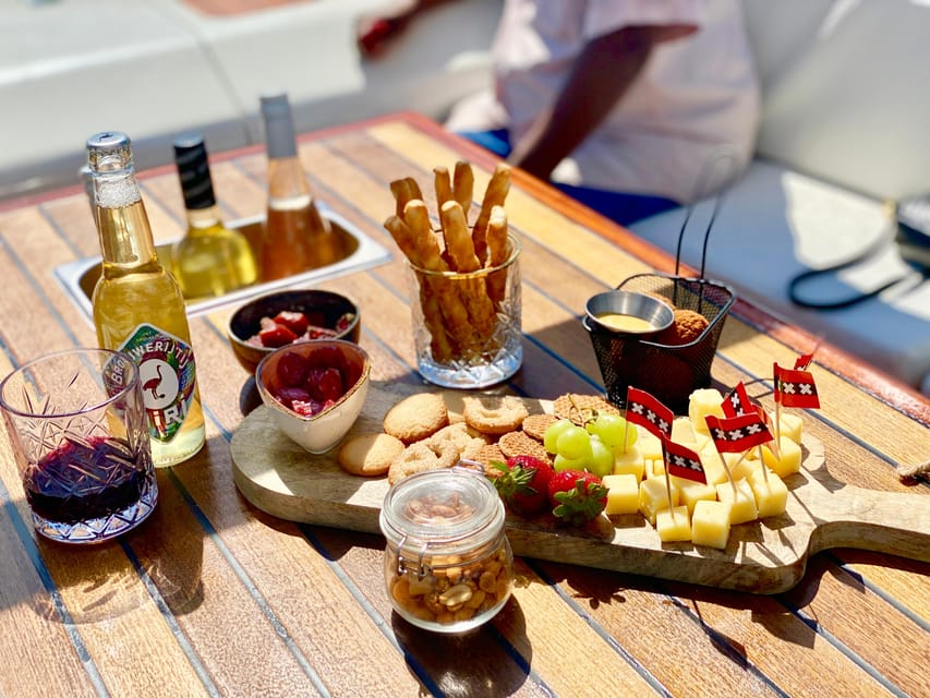 Amsterdam Small Group Canal Cruise inc Snacks/Drinks Winter - Heated sloop cruise, built for winter visibility