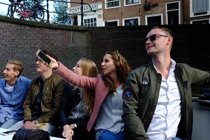 Amsterdam Small-Group Canal Cruise Including Snacks and Drinks - Jordaan canal time: Westertoren and Anne Frank House views