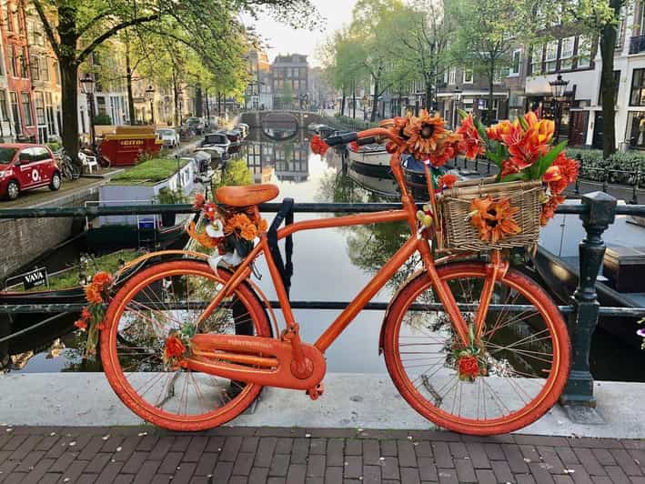 Amsterdam: Small Group Walking Tour with Fun Guide - Dam Square to Canals: The Route That Changes Your Perspective