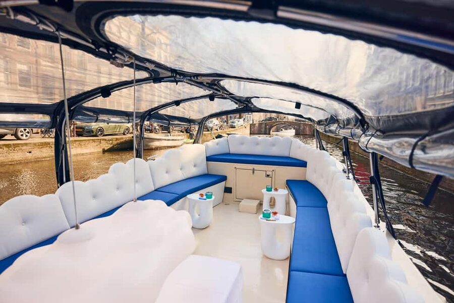 Amsterdam: Smoke & Cruise on covered Cannabis Boat With Bar - Coffeeshop history and decriminalisation talk, delivered in a chill way