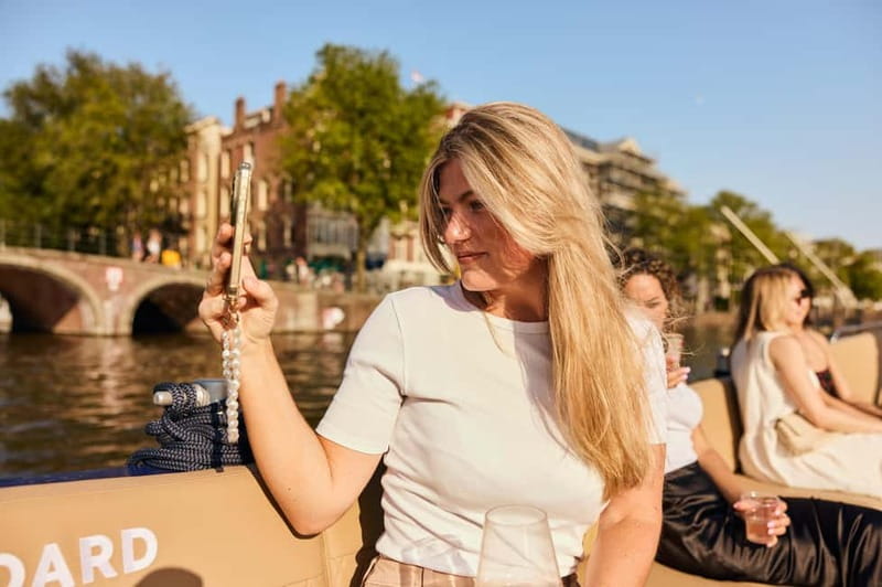 Amsterdam: Spanish Guided Open Boat Cruise with Bar Onboard - How to Make the Most of Your Seat and Photos