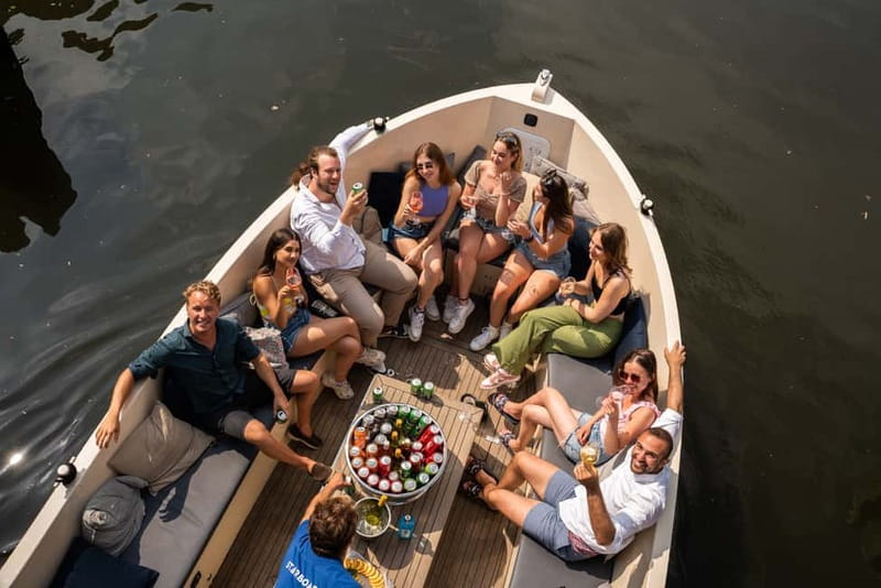 Amsterdam: Spanish Guided Open Boat Cruise with Bar Onboard - Should You Book This Amsterdam Canal Cruise?