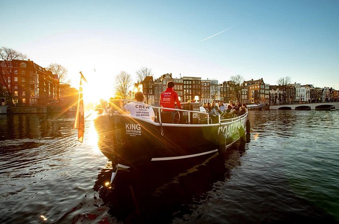 Amsterdam Sunset Canal Cruise with Live Guide and Open Bar - Jordaan, coffeeshop stopovers, and canal-side museum moments