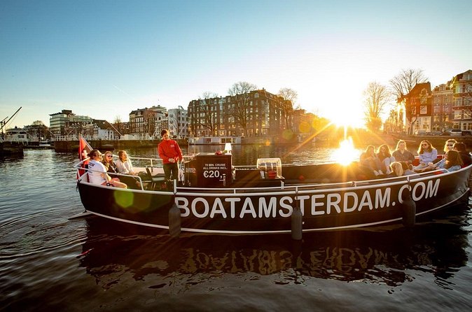Amsterdam Sunset Canal Cruise with Live Guide and Open Bar - NEMO, maritime museum vibes, and the east-side scenery