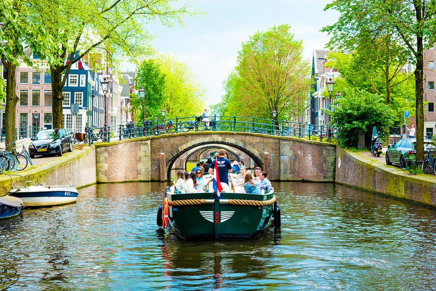 Amsterdam: The Newest Canal Cruise with Drink Option - The Skinny Bridge Moment and Dancing Houses Up Close