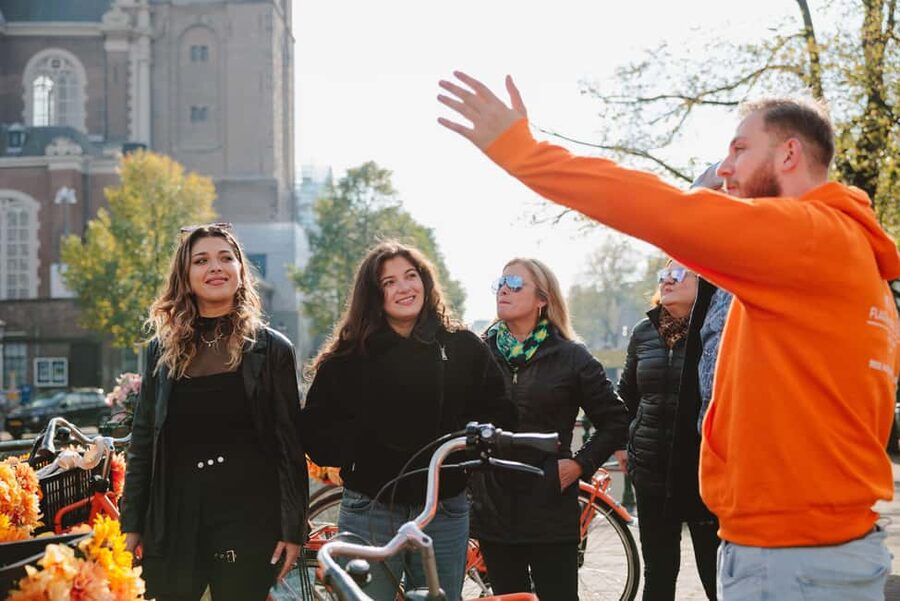 Amsterdam: Top Highlights Guided Bike Tour - Getting going at Nieuwezijds Voorburgwal 101, right near Central Station