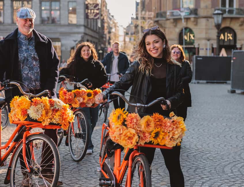 Amsterdam: Top Highlights Guided Bike Tour - Passing the Red Light District, then shifting to Leidse Square food energy