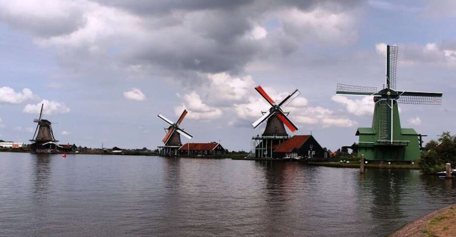 Amsterdam: Volendam, Windmill, and Cheese Farm Private Tour - Entering Zaanse Schans, where mills do real jobs