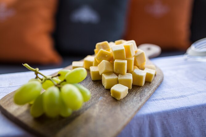 Amsterdam Walking Tour and Cruise with Drinks and Cheese Tasting - Nieuwmarkt and San Anton Gate: markets, walls, and street-level Amsterdam