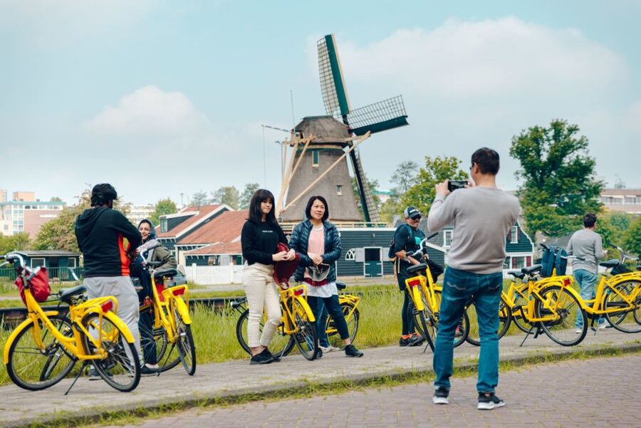 Amsterdam: Waterland District Countryside Villages Bike Tour - The first countryside glimpse: quick ferries and the D’Admiraal windmill stop