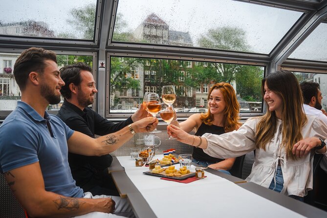 Amsterdam Wine and Cheese Evening Cruise - The canal route: Centraal, maritime artifacts, Skinny Bridge, and the Canal Ring