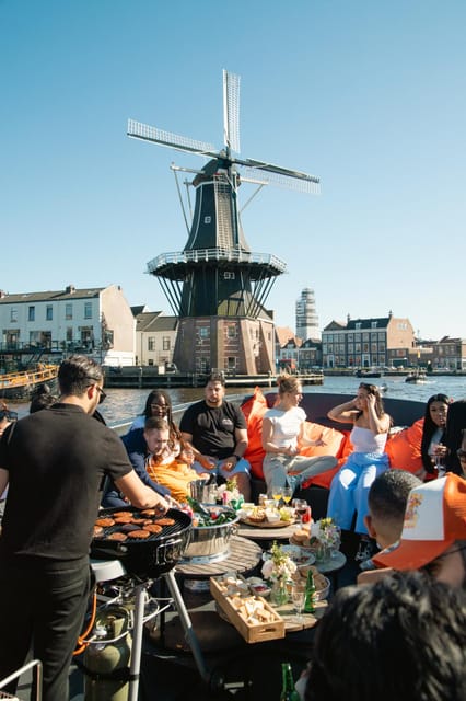 BBQ on Board Haarlem Cruise - The canal route, with Grote Kerk and Molen de Adriaan in sight