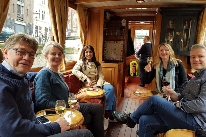 Eating Amsterdam: Food Tour & Canals Cruise - Jordaan walking segments: canals, Golden Age stories, and De Gangen