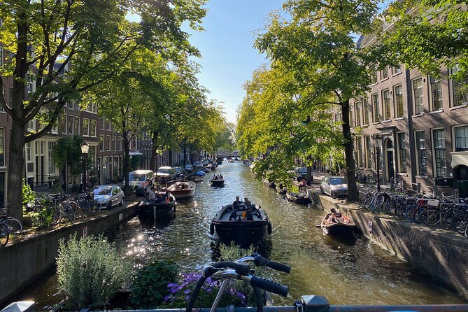 Explore hidden streets with friends - Private Tour - The Early Stops: From Amsterdam’s Origins to the Town Hall Building