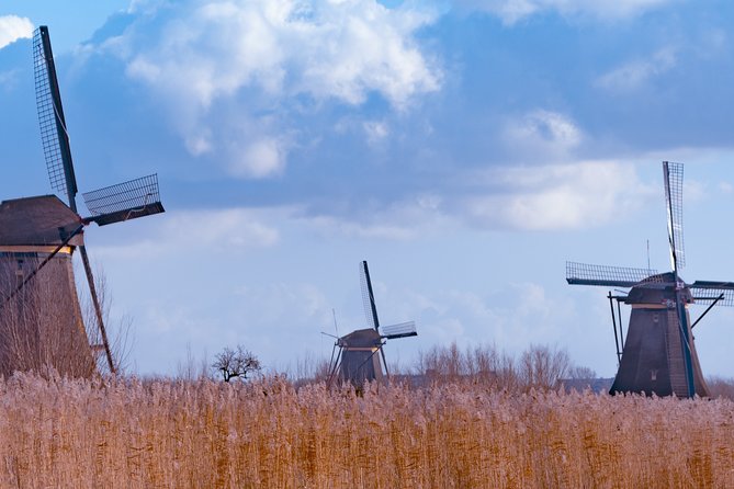 Famous Holland Tour: visit The Hague, Delft, Rotterdam and Kinderdijk from A'dam - Stop 2: Delft canals, gables, and towers in a smaller-than-Amsterdam world