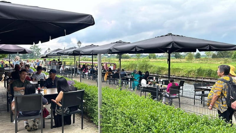 From Amsterdam to Giethoorn Day Trip - The canal cruise hour: thatched roofs, bridges, and a captain’s story