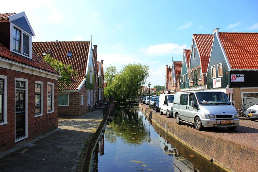 From Amsterdam: Windmills & Volendam Private Tour - Volendam: fresh fish, an old port, and a dyke boulevard stroll